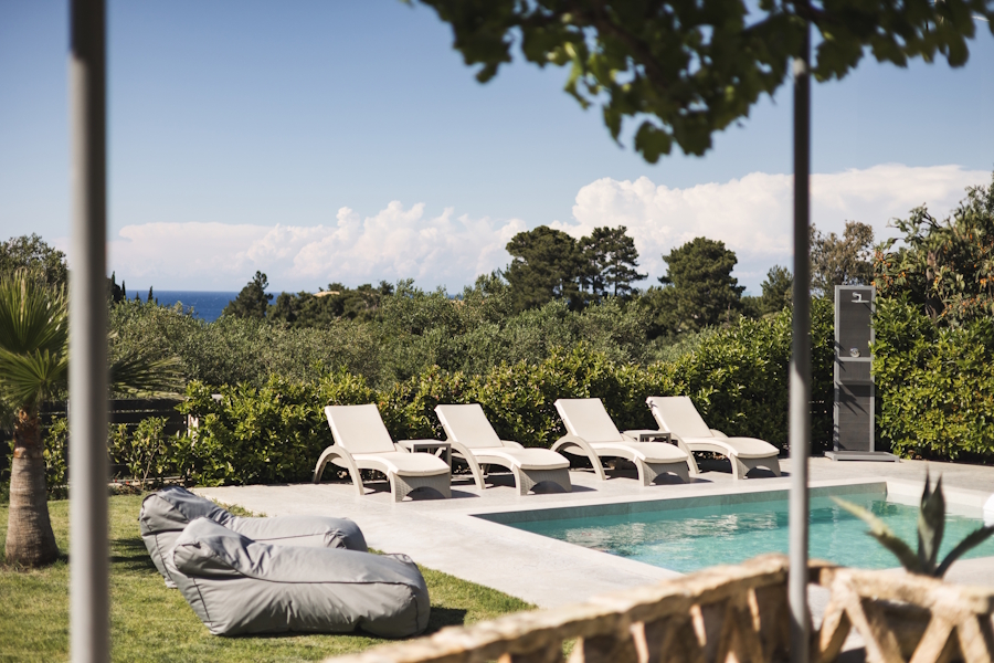 Peaceful view of the villa’s private pool surrounded by nature