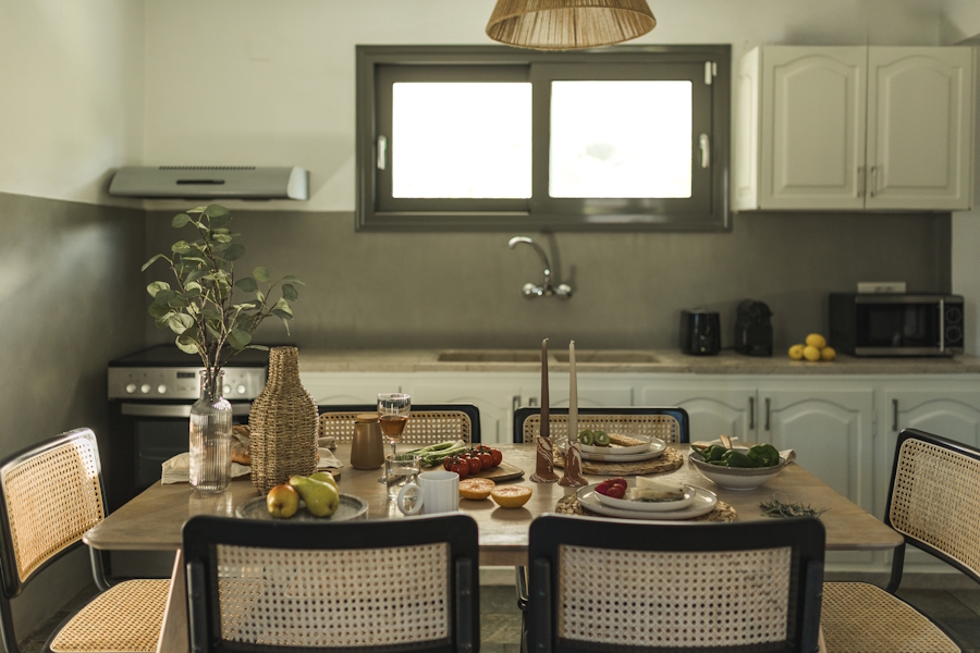 Fully equipped kitchen with set table at Binios Villa